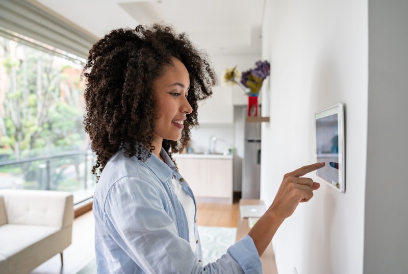 Woman Using a Home Automation Service