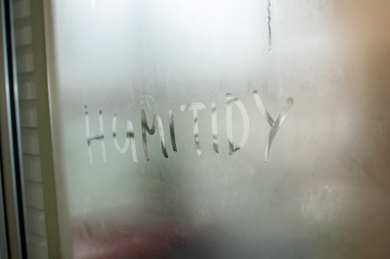 "Humidity" Written in Condensation On Window